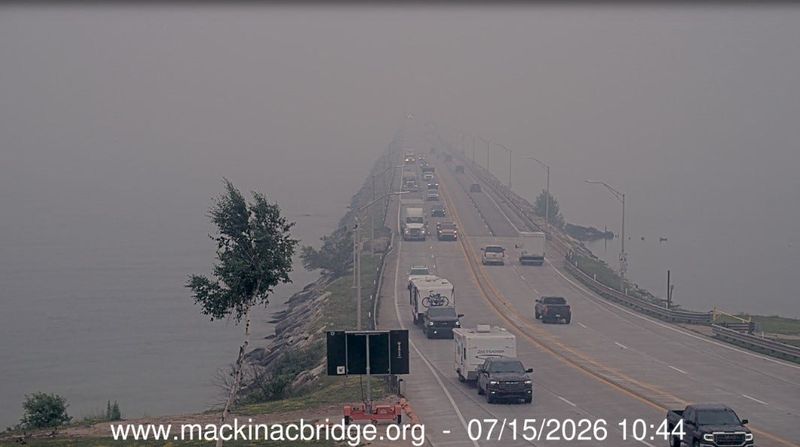 Canadian wildfire smoke blankets the Straits of Mackinac, reducing visibility on the Mackinac Bridge on Wednesday, July 15, 2026 in Mackinaw City, Mich.