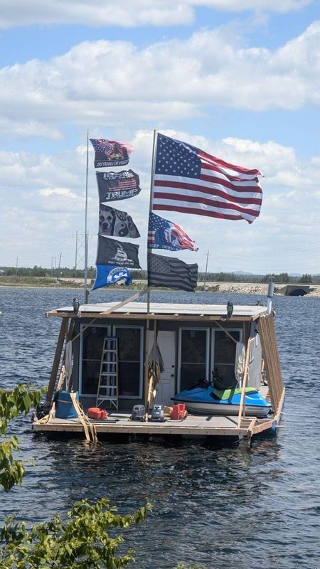 The Neverlanding houseboat owned by Steve Mylrea, of Harrow, Ontario, has been criticized by Canadians for failing to fly a Canadian flag while in Canadian water and for flying three flags related to President Donald Trump.