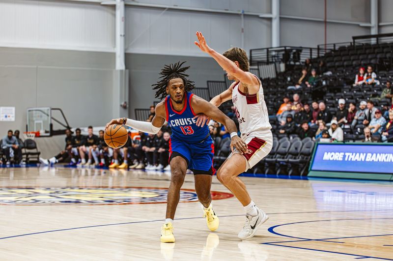 Detroit Pistons two-way forward Isaac Jones dribbles in a game for the Motor City Cruise, the team's G League affiliate.