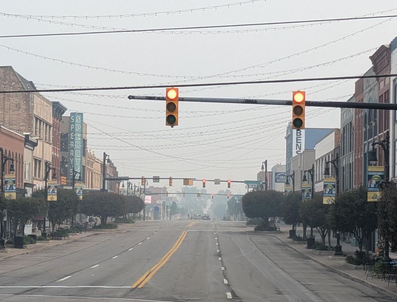Smoke from Canadian wildfires covers downtown Port Huron on July 16, 2026