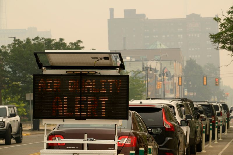 A sign on Cass Ave. alerts motorists in Detroit about the air quality, July 16, 2026. Wildfire smoke cloaked Metro Detroit on Thursday, creating a thick haze after traveling hundreds of miles from Ontario and northern Minnesota, where raging wildfires are sending a cloud of ash into the air. (David Guralnick / The Detroit News)