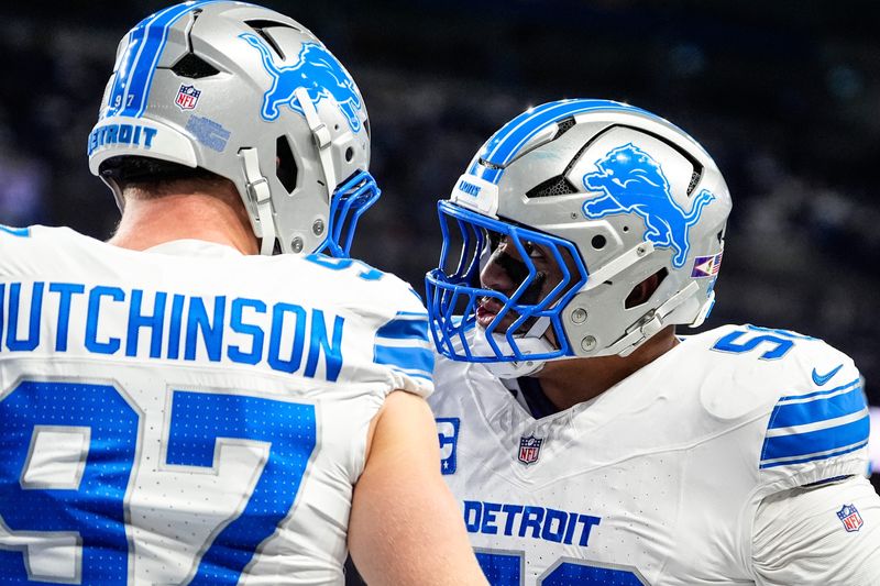 Detroit Lions defensive end Aidan Hutchinson (97), left, talks to offensive tackle Penei Sewell (58) during warmup before the Dallas Cowboys game at Ford Field in Detroit on Thursday, Dec. 4, 2025.
