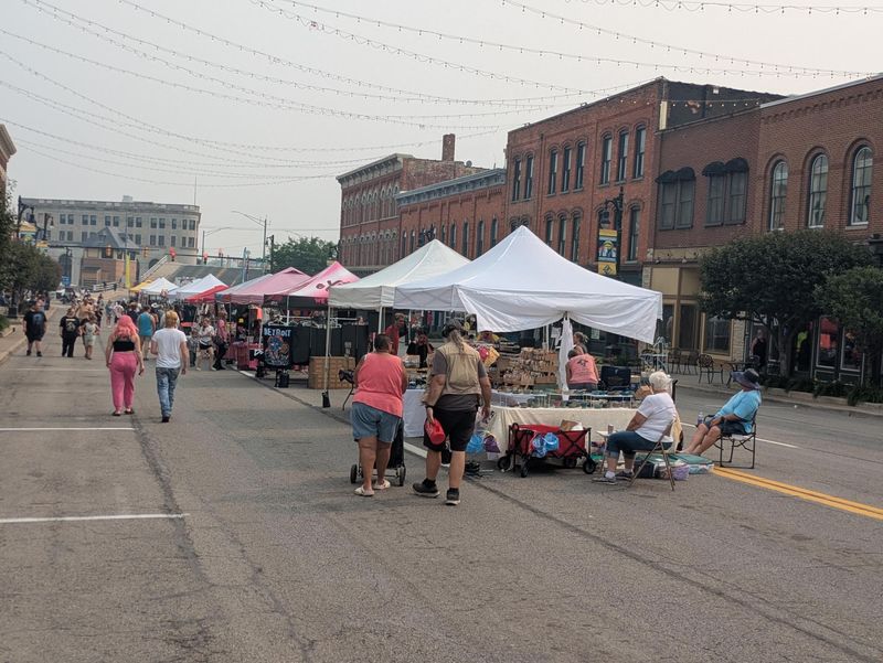 Vendors set up on Huron Avenue for the street fair on July 17, 2026.