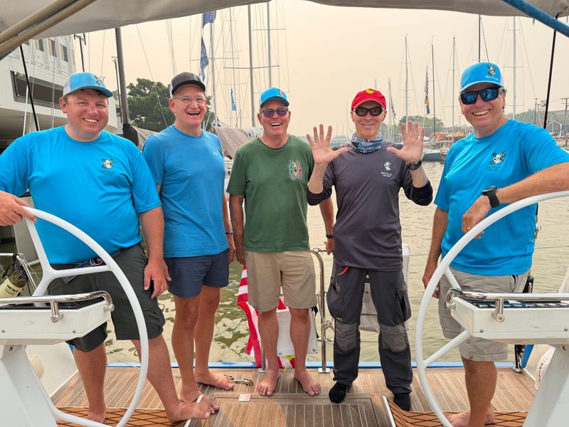 From left, Lance Kitchens, Bill Bertrand, Jake Brodersen, Stanley Carroll and Dan Kitchens pose aboard Skull Cracker on the Black River in Port Huron on Friday, July 17, 2026, one day before the start of the 102nd Bayview Mackinac Race.