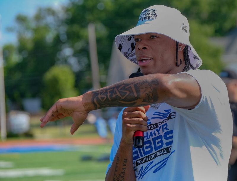 Jahmyr Gibbs, Detroit Lions stand-out running back welcomes and speaks to the hundreds of attendees and their families of his youth football camp held at Eastern High School's football stadium Saturday, July 11, 2026.
