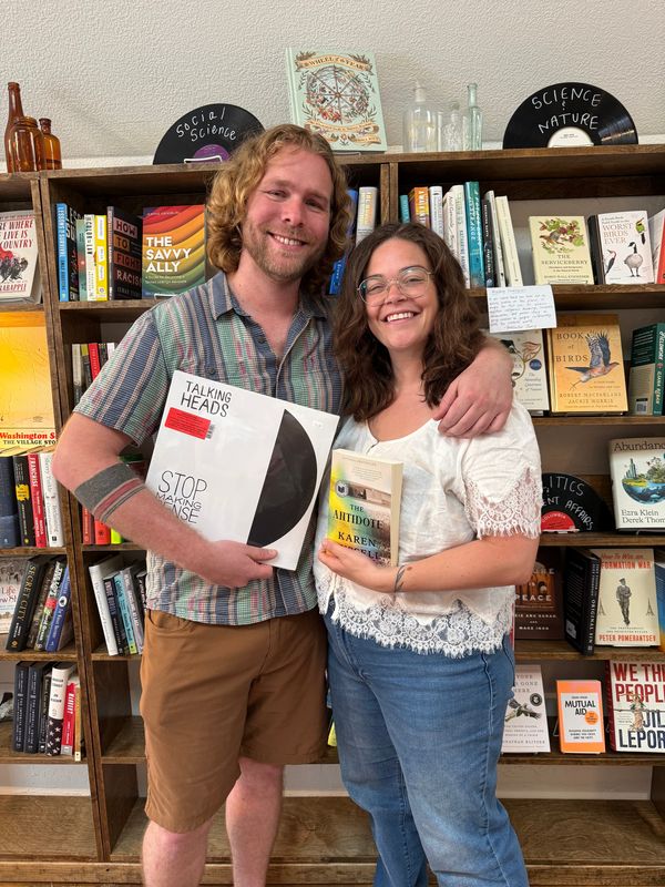 Josh Johnson and Jenny Kinne pose for a photo inside Antidote Books & Records in Holland.