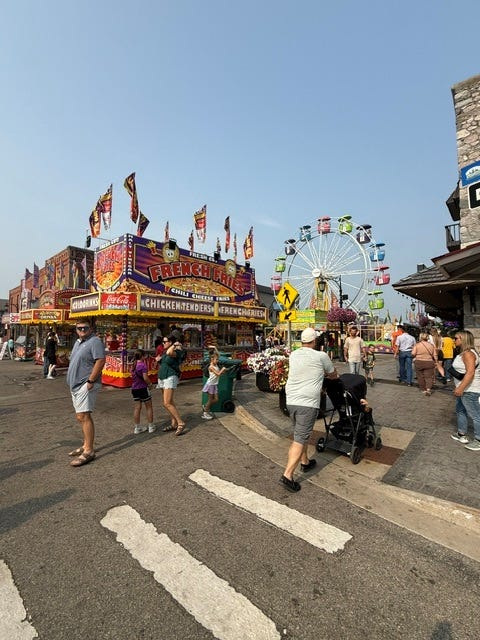 Visitors explore rides, food and local shops in the heart of Gaylord's Alpenfest in July 2026.