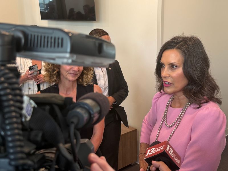 Michigan Gov. Gretchen Whitmer speaks with reporters after signing legislation aimed at expanding housing on Tuesday, July 21, 2026, in Grand Rapids, Mich.
