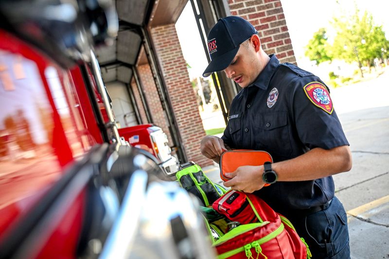 Firefighter Zane Nianan works on an equipment check for one of the fire trucks on Wednesday, July 22, 2026, at the  Grand Ledge Emergency Services building.