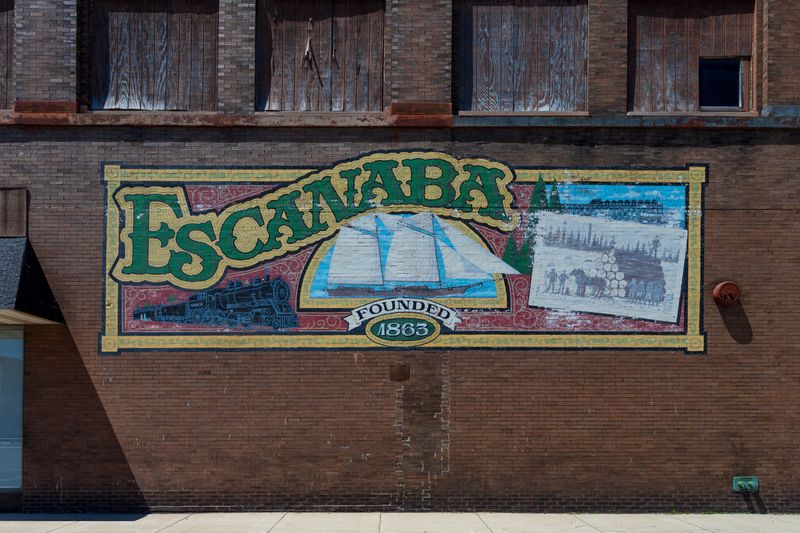 A mural promoting Escanaba, a city in Michigan's Upper Peninsula, is pictured on a brick building in the city's downtown.