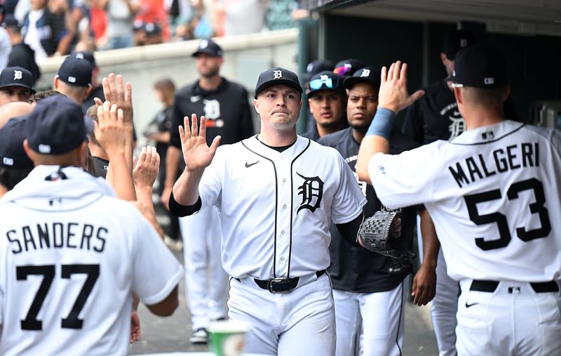 Tigers pitcher Tarik Skubal, center, is high-fived in the dugout after exiting the game in the seventh inning.