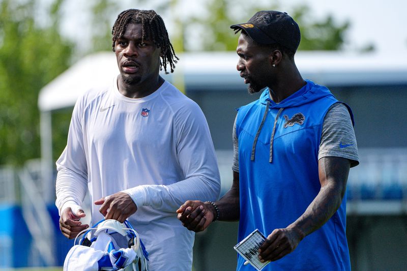 Detroit Lions safety Kerby Joseph (31), right, talks to linebacker Damone Clark (11) after practice during training camp at Meijer Performance Center in Allen Park on Thursday, July 30, 2026.