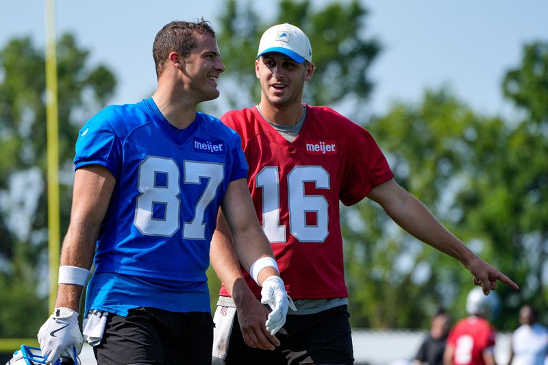 Detroit Lions tight end Sam Laporta (87), left, talks to quarterback Jared Goff (16)  after practice during training camp at Meijer Performance Center in Allen Park on Thursday, July 30, 2026.