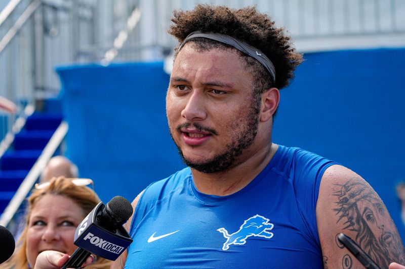 Detroit Lions offensive lineman Christian Mahogany (73) speaks media members after practice during training camp at Meijer Performance Center in Allen Park on Friday, July 31, 2026.