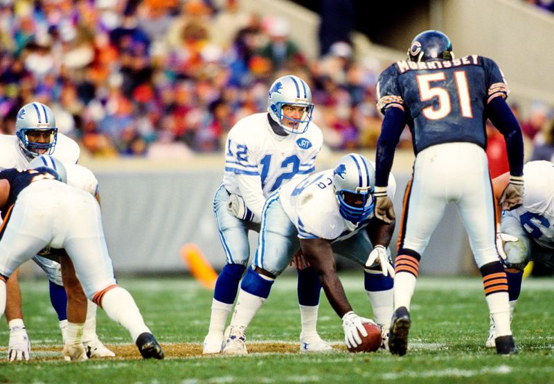 Nov 3, 1991; Chicago, IL, USA; FILE PHOTO; Detroit Lions quarterback Erik Kramer (12) lined up under center Kevin Glover (53) against Chicago Bears linebacker Jim Morrissey (51) at Soldier Field
. Mandatory Credit: RVR Photos-USA TODAY Sports