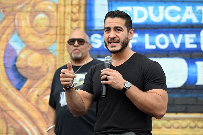 Michigan Democratic U.S. Senate primary candidate Abdul El-Sayed, front, talks to supporters as the Rev. Horace Sheffield III stands behind him at a campaign rally in Detroit, Saturday, Aug. 1, 2026.
