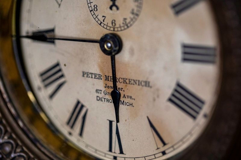 An alarm clock, originally built by jeweler Peter Merckenich sometime in the early 1900's sits in Chris's Clock Repair in Southfield Tuesday, Jan. 5, 2022. The clock was purchased from a consignment shop by Chris Schroeder who subsequently repaired it.