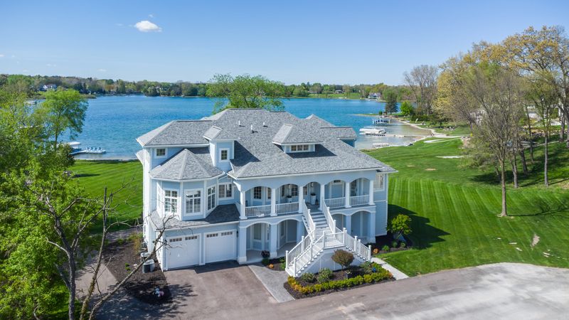 This home at 10195 Bennett Lake Road in Fenton features five bedrooms and six bathrooms across 6,195 square feet. It’s situated on private Marl Lake with direct access to Silver Lake. There is also a private elevator to access all levels.
