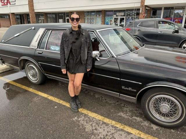 Hailey Garza of Mount Morris with her hearse at Screamers car show in Clinton Township on Sunday, Aug. 2, 2026.