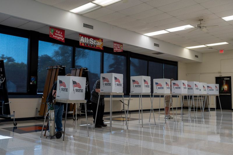 Voters cast their ballots during Michigan’s primary election at Kaiser Elementary School during Michigan’s primary election in Roseville on Tuesday, Aug. 4, 2026.