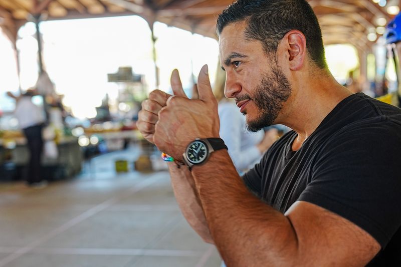 Abdul El-Sayed, a democratic candidate for U.S. Senate, talks with voters at Eastern Market in Detroit, Tuesday, Aug. 4, 2026.