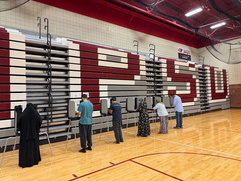 Voters cast ballots at Hamtramck High School on primary election day on August 4, 2026.