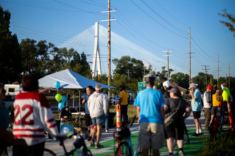 People wait to cross the Gordie Howe Bridge on Wednesday, Aug. 5, 2026, in Detroit. The bridge opened to pedestrian and bicycle traffic today.
