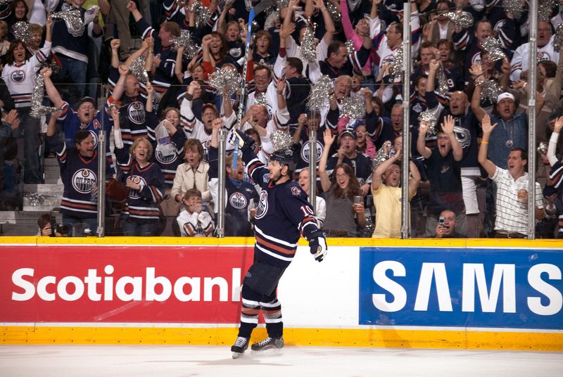 Jun 17, 2006; Edmonton, Alberta, CAN; Edmonton Oilers left wing Shawn Horcoff (10) celebrates on the ice during game six of the Stanley Cup Finals against the Carolina Hurricanes at Rexall Place. Credit: Lou Capozzola-USA TODAY NETWORK