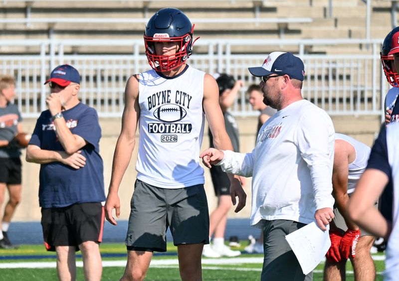 Boyne City head coach Dave Suttle (right) has a new leader under center in Drew Bryant (left), who will try to take over a team with plenty of veterans back at other positions.