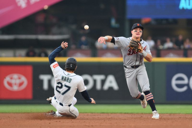 Aug 5, 2026; Seattle, Washington, USA; Detroit Tigers shortstop Kevin McGonigle (7) throws to first base to complete a double play against the Seattle Mariners during the third inning at T-Mobile Park. Mandatory Credit: Steven Bisig-Imagn Images