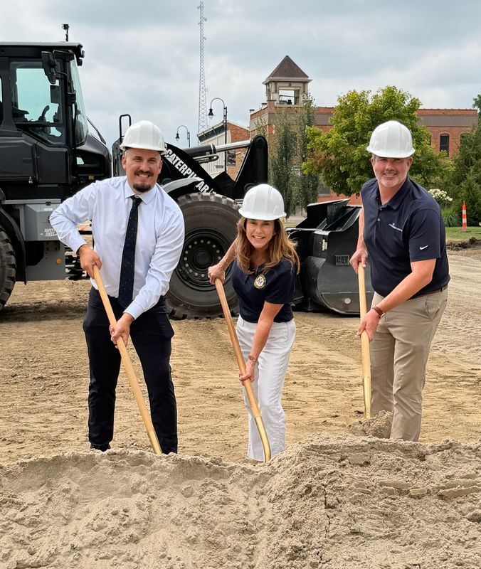 Village Manager Travis Youatt (left), U.S. Rep. Lisa McClain (center) and Chris Hennessy of Fleis & VandenBrink (right) participate in a ceremonial groundbreaking for Capac's Main Street Streetscape Project on Aug. 6, 2026, in Capac.