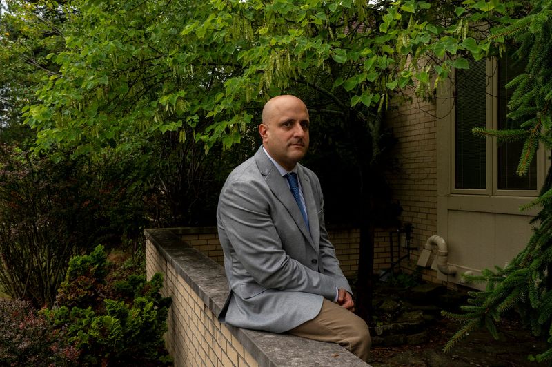 Joe Tigay, 44, a financial adviser with Equity Armor Investments and portfolio manager for the Rational Equity Armor Fund (HDCTX), sits outside his home in Bloomfield Township on Thursday, Aug. 6, 2026.