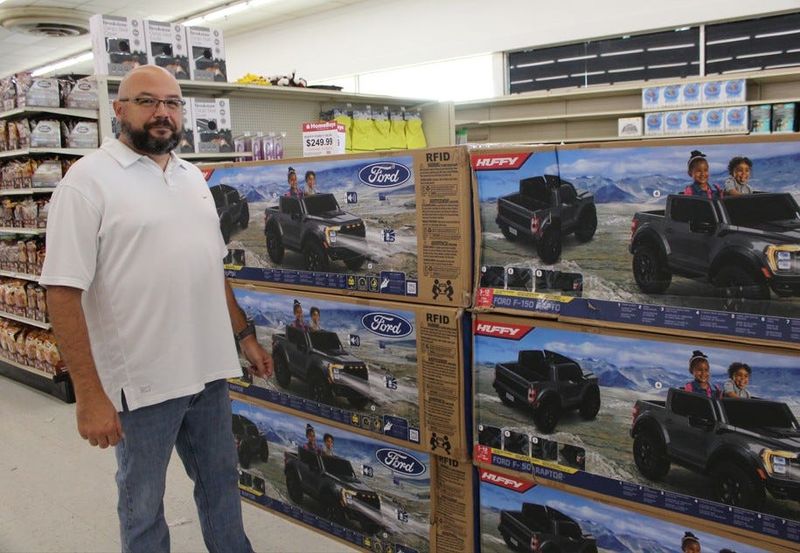 HomeBuys store manager Brian Snow prepares for the Monroe store's grand opening slated for Thursday, Aug. 13, 2026