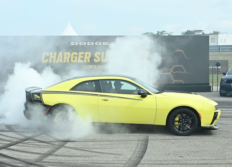 Dodge CEO Matt McAlear, with the Dodge Charger Super Bee at the 'Roadkill Nights' preview, before opening to the public on Saturday, at M1 Concourse in Pontiac, Michigan on August 7, 2026.