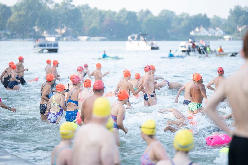Swimmers take off from the starting line during the open water swim race at Goguac Lake on Saturday, Aug. 8, 2026.