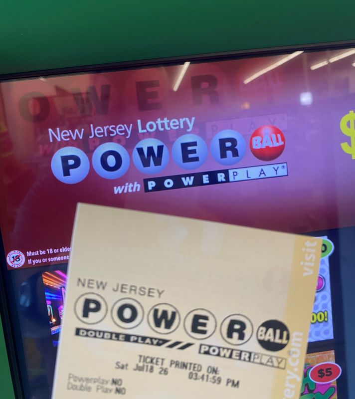 A Powerball ticket and the Powerball logo on a vending machine in Bloomfield, N.J. on July 18, 2026