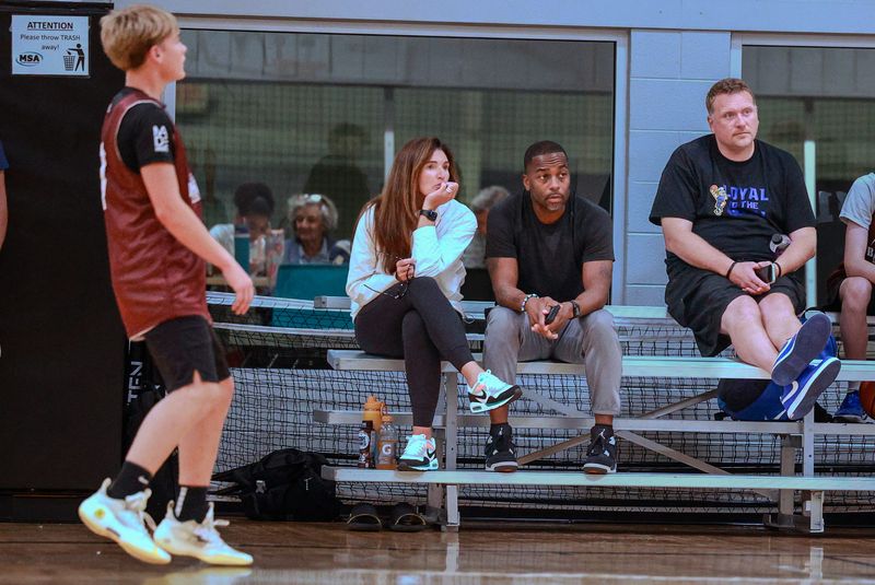 University of Michigan basketball coach Mike Boynton and his wife Jenny Boynton watch their son play at the Bank Hoops Underclassman All-State Camp in Grand Rapids on Sunday, Aug. 9, 2026.