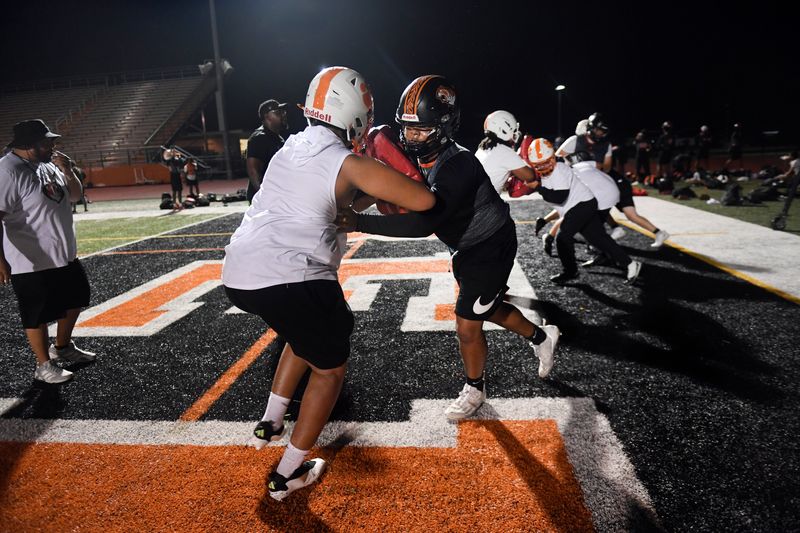 Belleville football players work on their tackling skills on the first day of practice, Monday, Aug. 10, 2026, in Belleville.