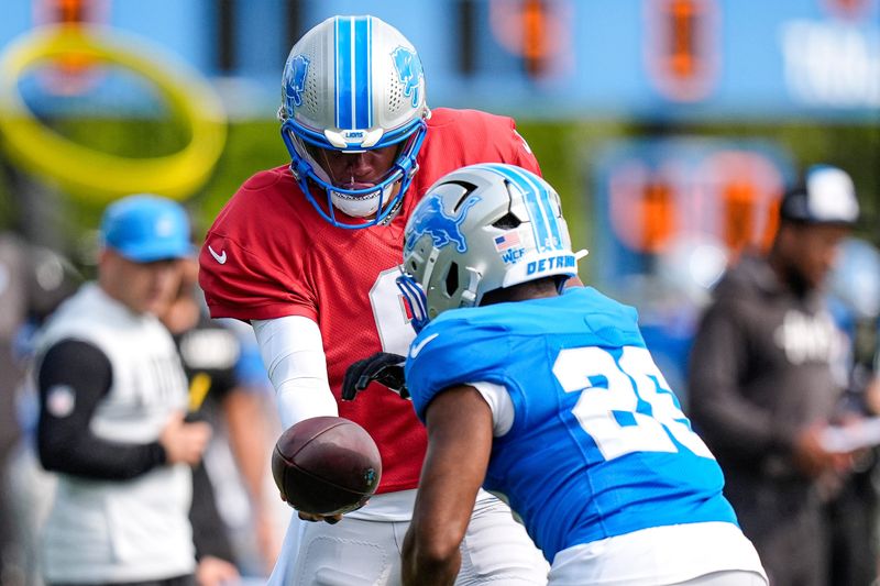 Detroit Lions quarterback Josh Dobbs (6) practices with running back Jabari Small (26) during training camp at Meijer Performance Center in Allen Park on Monday, August 10, 2026.