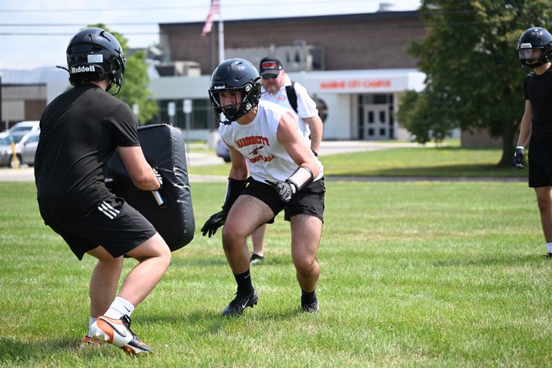 Marine City's Mason Hemeryck goes through a drill during the first day of football practice at Marine City High School on Monday, Aug. 10.