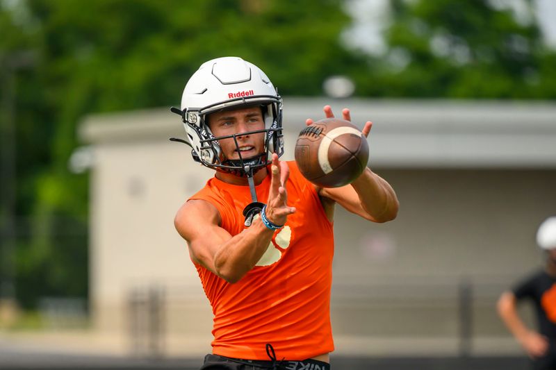 Wide receiver Jamo Parsell catches a pass during the first day of football practice at Brighton high school, Aug. 10, 2026.
