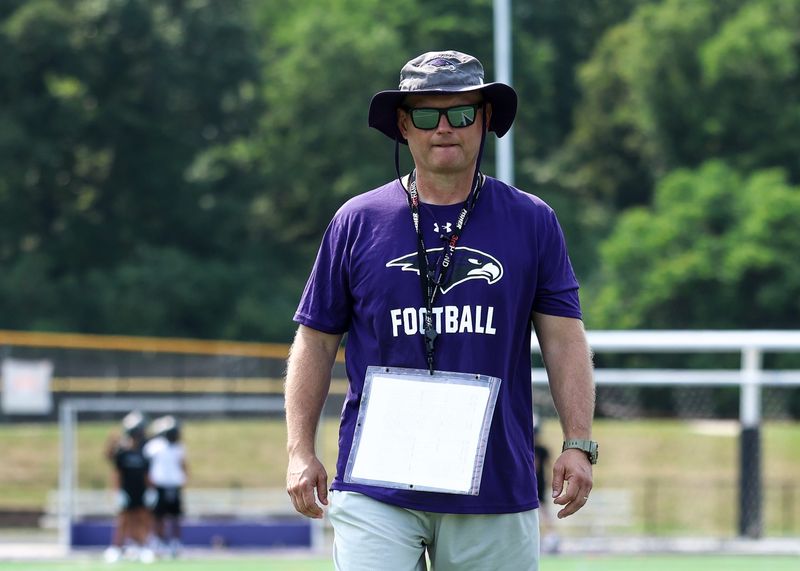 Bloomfield Hills coach Scott Merchant watches his team during a football practice on Monday, August 10, 2026