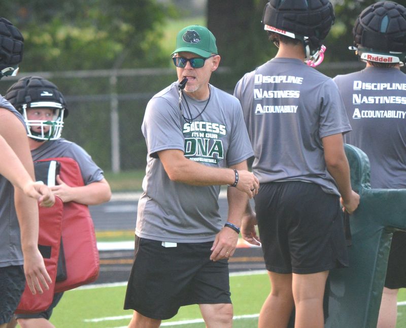 Marty Martin is the new head coach at Pennfield. Martin works his team through drills on the first day of preseason practices at Pennfield High School on Monday, Aug. 10.