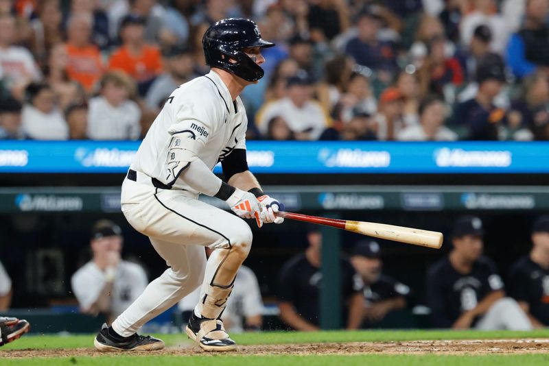 Tigers third baseman Kevin McGonigle hits an RBI single in the seventh inning against the Guardians.