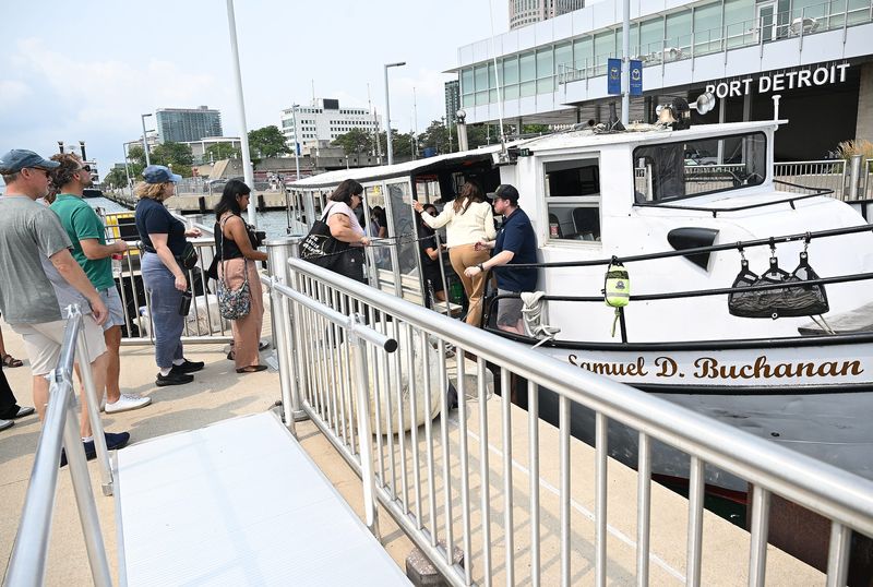 Guests board the Samuel D. Buchanan tour boat for a tour of the Detroit River on Tuesday, August 11, 2026, in Detroit, MI
