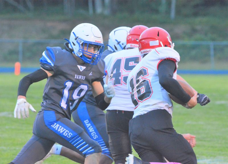 Inland Lakes linebacker Collin Maves (19) prepares to bring down Onaway’s Lelin Splan during a football game from the 2025 season. Back with the Bulldogs for his senior year, Maves will be a leader at linebacker again and get carries at running back.