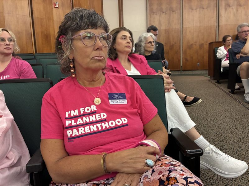 Tammy Warren of Wixom, 55, listens to public comment ahead of a vote to fund the Planned Parenthood clinic in Ferndale on Thursday, Aug. 13, 2026, at the Oakland County Board of Commissioners chambers.