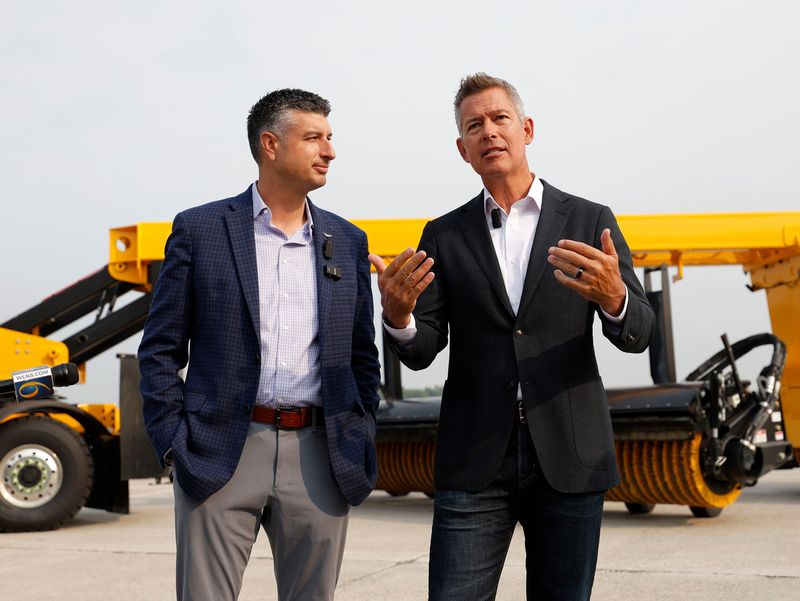 Transportation Secretary Sean Duffy, right, speaks as U.S. Rep. Tom Barrett listens Thursday at the Capital Region International Airport in Lansing. Barrett, R-Charlotte, clashed this week with his 7th Congressional District Democratic opponent, Will Lawrence, over data center policy.