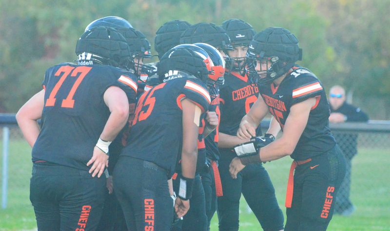Cheboygan football players huddle up for an offensive play during the 2025 season last fall. Because of low numbers and student safety concerns, Cheboygan's varsity program had to officially cancel its 2026 season on Thursday, Aug. 13.