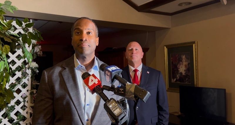 U.S. Rep. John James, R-Shelby Township, appears at a Macomb County GOP convention at the American Polish Century Club in Sterling Heights on Thursday, Aug. 13, 2026, alongside his chosen running mate state Rep. Jay DeBoyer, R-Clay Township.